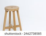 The long round wooden chair is...