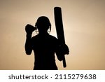Small photo of Silhouette of a cricketer celebrating after getting a century in the cricket match. Indian cricket players and sports concept.