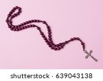 Rosary On A Pink Background....