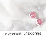 Ben Wa vaginal pleasure balls, Kegel balls on white background, top view, soft light, empty space for text