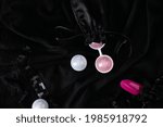 Vaginal pleasure balls Ben Wa, Kegel balls on black background, top view