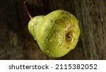 fresh green packham pear on... | Shutterstock . vector #2115382052