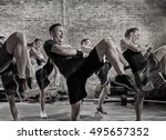 group of people practicing kick, workout class