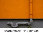 Water Pipe And Orange Wall