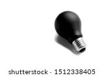Small photo of Black bulb isolated on white background. Concept of power outage or reactionary thought and ideas