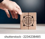 Small photo of Gig economy, freelance work, external hiring or hybrid workplace concept. Male hand puts wooden cubes with gig economy icon.