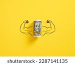 Bunch of United States dollar money with flexing muscle biceps on yellow background. Strong or highest currency concept.