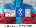 Small photo of Engineer holding colorful blocks sees illustration: CALIBRATE. Industrial concept of activate calibration, intermediate check or calibration measurement. Calibrated industry system.
