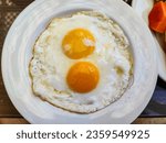 Two sunny side up eggs ready to ...
