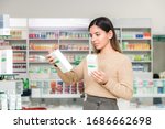 woman choosing vitamins and supplements for immune system. coronavirus pandemic necessity