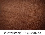 Small photo of natural leather texture background, brown cowhide closeup