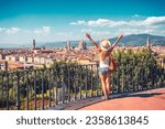 Happy woman with arms raised up enjoying panoramic of Florence Cityscape- tour tourism,travel,vacation in Italy-Europe, Firenze  