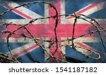 Small photo of barbed wire in front of an old stained dirty union jack british flag with dark crumpled edges brexit freedom of movement isolationist concept