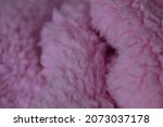 Small photo of pink sherpa plush cloth textured background