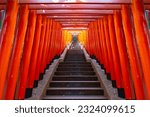 Small photo of red torii tunnel and the stairs leading up to Hie Shrine, This is a famous shrine. in Tokyo Japan.