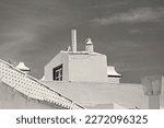 Small photo of Traditional houses and portugese architecture of Albufeira Old town, Algarve, Portugal. Clack and white photo