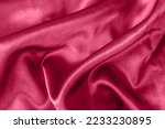 Small photo of Elegant smooth satin folds closeup viva magenta colored. Cloth texture background. Abstract wallpaper. Trendy dark skyblue backdrop for web design. Luxury twisted fabric backplate