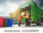 Small photo of Men who dispose of rubbish that works for public benefit, empty trash container of the Thai Public Health Division in Asia