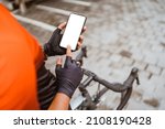 cyclist check his workout progress on a smart phone