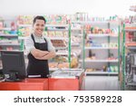 Portrait of a smiling shopkeeper in a grocery store