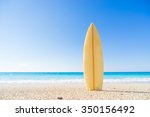 Surf Board In The Sand At The...
