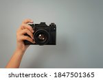 photo camera in one hand of a girl