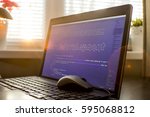 Small photo of Web development phrase ASCII art inside HTML code. Web developer workplace in sunset lights. Abstract information technology background. Laptop and mouse on keyboard.