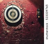 Small photo of The dartboard game on the red wall. There are many games that can be played on a dartboard, but darts generally refers to a game whereby the player throws three darts per visit to the board.