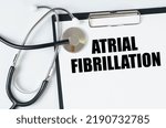 Small photo of Medical concept. On a white surface, a stethoscope and a tablet with an inscription - Atrial Fibrillation
