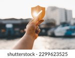 Small photo of Businessman holding shield protect icon, Security protection and health insurance. The concept of family home, foster care, homeless support, protection, health care day and home school education.