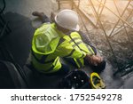 Small photo of Construction worker accident, Accidents at work, Builder accident fall scaffolding to the floor, Safety team help employee accident, Basic first aid training for support accident in site work.