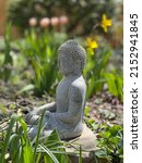 Buddha Statue In A Garden With...