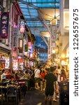 Small photo of CHINATOWN, SINGAPORE - NOV 3, 2018: Chinatown food street (CFS) on Smith Street at night. Restaurants, food kiosks and hawkers are operating under a cover selling a large variety of Singapore cuisine