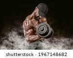 Professional weightlifter is training in the gym. Dumbbell Curl. Bodybuilding concept. Mixed media