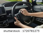 Woman hand holding steering horn