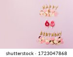 Small photo of Happy birthday candles and numbers 68 on a pink background decorated with pastel confetti. Celebrating the sixty-eighth anniversary. Place for text.