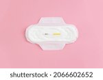Small photo of Сlean feminine sanitary napkin with an unused express FSH test. The minimum concept of the absence of menstruation in a woman. Copy space