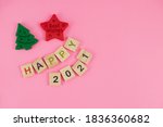 Happy New Year and Merry Christmas. Scrabble letters, playdough and plasticine. Letter tiles spelling celebration holiday.