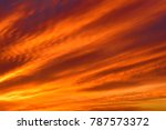 Sky with clouds in sunset time. Blurred background - sunset colors .