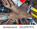 Different construction tools with Hand tools for home renovation on wooden board maintenance and reparing concept.