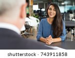 Young female candidate laughing at job interview