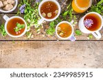Small photo of Different herbal tea set. Various cups with organic herbal, flower tea - camomile, chicory, melissa mint, lavender. Organic natural drinks concept. Health and immunity care beverages