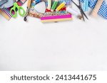 Small photo of Sewing, needlework and clothing repair, background, scrapbooking, quilting. Colorful pieces of fabric, scissors, ruler, sewing tools, needles, threads on a white table background top view copy space