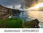 Cliffs of Moher above the Atlantic Ocean at sunset, Ireland.