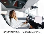 Side view relaxed woman with closed eyes customer female buyer client in white shirt choose auto want buy new automobile in car showroom vehicle salon dealership store motor show indoor. Sales concept