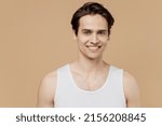 Small photo of Attractive handsome smiling fun cheerful young man he 20s perfect skin wearing undershirt look camera isolated on plain pastel beige background studio Skin care healthcare cosmetic procedures concept