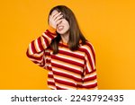Small photo of Young sad ashamed caucasian woman 20s in red striped sweatshirt put hand on face facepalm epic fail mistaken omg gesture isolated on plain yellow background studio portrait. People lifestyle concept