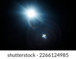 Small photo of Easy to add lens flare effects for overlay designs or screen blending mode to make high-quality images. Abstract sun burst, digital flare, iridescent glare over black background.