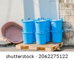 Blue Pail With Lids Stacked On...