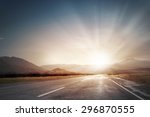 Picturesque landscape scene and sunrise above road